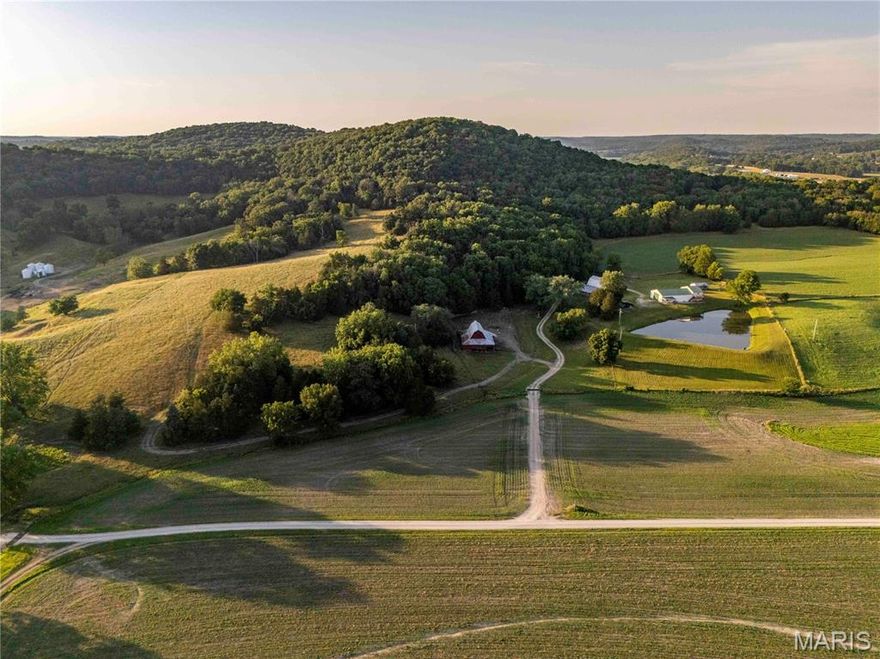 Situated just north of Hermann, MO and West of Hwy 19, this 185+/- acre farm offers a well-rounded mix of features.   The scenery at this farm is incredible.  With high wooded peaks overlooking the Loutre River bottom, good pasture for livestock & some tillable acreage for income.  All of this creates an awesome habitat for wildlife & views that never get old.  This farm would make a perfect hunting & recreation piece, great hobby farm or private residence. Several historical barns remain on-site, with large shop building featuring finished living quarters—complete w/kitchen, 1.5 bathrooms, bar, bunk loft, and a deck overlooking a stocked pond. The building makes for a great hunting lodge. It has plenty of room for lots of hunters, tools, toys and equipment. Located just 3 miles west of Big Spring, MO, this property is just 1 hr from Chesterfield Valley, 1 hr from Columbia, MO and you can be in downtown Hermann in under 20 minutes!