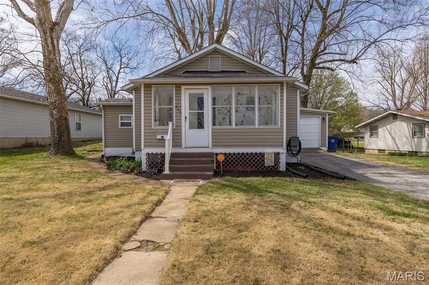 Charming, quaint, and beautifully updated—this inviting home in the heart of Festus is ready to impress! Step inside to discover spacious living area complemented by stunning hardwood floors. An enclosed front porch adds character and versatility—perfect for a cozy sitting area, sunroom, reading nook, or playroom. The thoughtfully remodeled kitchen offers modern style and functionality, perfect for everyday living and entertaining. Enjoy a separate dining room, ideal for gatherings, plus a versatile bonus room that works wonderfully as extra storage or a walk-in pantry. The basement provides even more space and is currently used as a home office with tons of storage, offering flexibility to suit your needs.
Outside, the large lot opens up to a huge yard—ideal for relaxing, gardening, or hosting get-togethers. An attached garage and extended driveway provide ample off-street parking.
Conveniently located and competitively priced, this home is FHA eligible and packed with value. Don’t miss your chance—come see it for yourself at the open house on Sunday, 3/29 from 1–3 PM!