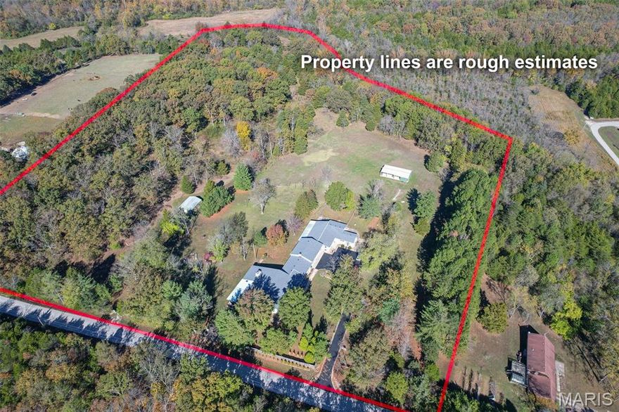 Welcome to your dream retreat — a rare opportunity to own a 16-acre estate designed for comfort, income potential, &/or equestrian living. This expansive property features two separate homes, ideal for multi-generational living, rental income, or guest accommodations. Both homes have had updates and meticulously maintained. I will do my best to describe the endless features and possibilities this home has to offer, but seeing is believing.

Main residence is beautifully appointed 4-bedroom, 3-bath home offering 3,000± sq ft of thoughtfully designed living space, perfect for families of all sizes or those who love to entertain. Bathed in natural light and surrounded by serene countryside views, this home blends comfort, functionality, and charm. Highlights include:  generous family room with a cozy wood-burning fireplace, custom cabinetry, and a built-in bar sink—ideal for gatherings and game nights; a chef’s dream kitchen featuring an oversized custom island, breakfast bar, with ample counter space for baking, prepping, or casual snacking; formal dining area with built-in cabinetry—perfect for hosting holiday meals or intimate dinners; primary suite with a private full bath; plus two additional bedrooms (one could easily serve as a second primary) sharing a full bath; fourth bedroom; and charming music room with built-in shelving—ideal for a den, studio, or creative space; expansive back deck with built-in seating & screened-in section, offering a peaceful spot to enjoy morning coffee or evening sunsets.

Second home is a beautifully designed 2-bedroom, 2-bath home that blends comfort, functionality, and charm with 2,000 +/- sq ft.  Home has it's own private entrance--perfect for extended family, caretakers, or as a rental unit to generate passive income. Open-concept living, kitchen, & dining areas create a welcoming atmosphere perfect for cozy gatherings. Enjoy two generously sized bedrooms and two full baths—one featuring a tub/shower combo & the other a walk-in shower. Spacious family room offers endless possibilities, whether you envision a home office, creative studio, or business space--complete with built-in cabinets & shelving. Just off the kitchen, the sunroom beckons with abundant natural light & serene views of the property. Whether you dream of a peaceful sitting room, a lively game space, or a quiet reading nook, this space is ready to become your personal haven. Step outside to a fenced area perfect for your furry companions, & unwind on the large covered porch—ideal for entertaining or simply soaking in the tranquility.

There are 16 acres, perimeter fenced, where wide-open spaces meet serene country living with easy access to I44. Horse-friendly acreage offers room to ride, roam, and revel in nature’s beauty. Land features flat to gently rolling terrain, dotted with mature trees & open pasture, creating a private and peaceful setting ideal for hobby farming, or recreation. Amenities include:  large equipment shed, formerly a barn/stable—or use for versatile storage; additional shed for tools/equipment.

Whether you're seeking a country lifestyle in a convenient location, a smart investment, or a place to grow your dreams, this property delivers. Schedule your private tour today and experience the potential firsthand.