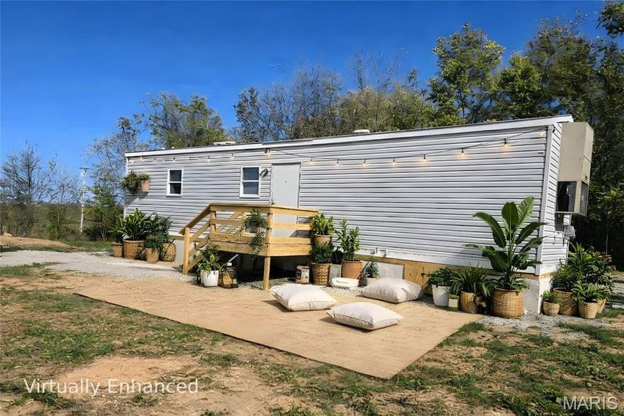 Immaculate updated manufactured home in Conway.  Central heat and air, public utilities. Appliances, partially furnished. Ready to move into.  New appliances. You will love how compact and efficient  this home really is!  Concrete pad, with block foundation. Loads of storage.  Large corner lot.  Plenty of room for a carport, garage, garden. Near all amenities.