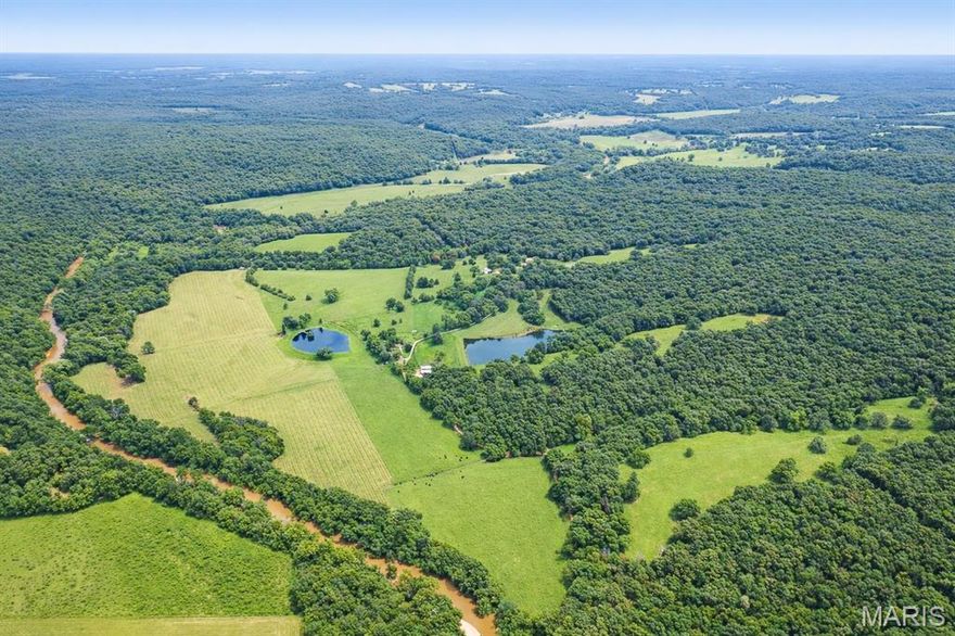 This has to be one of the most beautiful farms that I have ever seen. Close to a mile and half of beautiful flowing Upper Meramec River frontage with its trophy Small Bass Fishing and a stocked 4± acre clear lake. There are also 3 springs.  There is nothing spared, the original farm home, the newer guest home and historical log home all with incredible views.  There are also several very nice barns that have very functional use. There are trails thru out, there is great whitetail and turkey hunting as well as other species. The pastures are lush with good fencing and home to a great herd of black Angus. This is a ranch that has been taken care of and loved and it is time for the next generation to make new memories. The farm is about an hour and half drive from St. Louis. Farms such as this do not come on the open market very often. this a treasure!