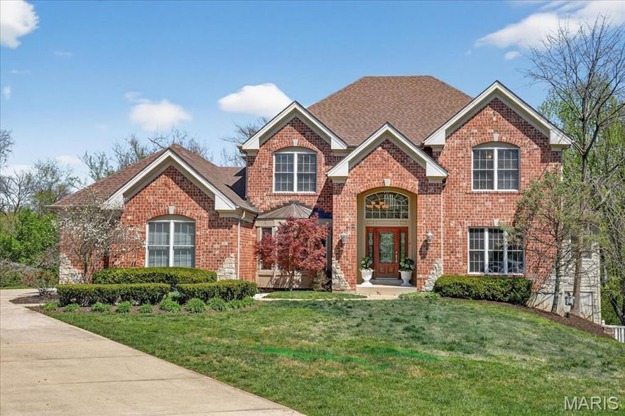 Welcome to this beautiful 1.5-story brick home, built in 2003, located on a spacious one-acre lot. Tucked away on a quiet cul-de-sac in the highly sought-after Ladue School District, this home blends comfort, style, and functionality.
The open floor plan features wood flooring throughout the main level and a dramatic two-story great room with soaring windows, abundant natural light, and a striking stone-surround gas fireplace. The great room flows seamlessly into the stylish kitchen, which boasts 42” maple cabinetry, granite countertops, stainless steel appliances, a 5-burner gas range, and a center island. The kitchen opens to a family room, creating an ideal space for everyday living and entertaining.
A well-equipped butler’s pantry connects the kitchen and great room, complete with a wine fridge, ice maker, sink, and ample cabinetry. Additional main-level conveniences include a walk-in pantry, mudroom with cubbies, laundry room, and a half bath, all located just off the kitchen near the 3-car garage.
The second floor offers three generously sized bedrooms and two full baths, including a Jack-and-Jill layout. The main floor spacious primary suite features two walk-in closets and a luxurious ensuite bath with a soaking tub and separate shower.
Step outside to enjoy morning coffee or evening dining on the large deck just off the kitchen and great room. The finished lower level with a wall of windows provides additional living space with a wet bar featuring cabinetry, a dishwasher, and a microwave, along with a fifth bedroom and full bath—perfect for guests. There is also abundant storage and direct access to the flat, private, fenced backyard with a patio.
Recent updates include a new roof, refinished wood floors, and fresh interior paint. Conveniently located with easy access to major highways, shopping, dining, and St. Louis’s premier medical facilities, this home truly has it all.