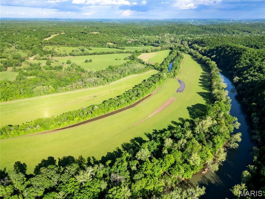 405-acre RIVER FARM with historic barn, 200 amp electric at the pole, and well. Property includes cattle corrals, perimeter/cross fencing, 55 tillable acres, 100 acres open grazing, and high-producing hayfields. Enjoy a private fishing lake, spring-fed pond, and approx. 1 mile of river frontage. Great access from Hwy 17. Excellent hunting with new elevated box blinds, 2 double tree stands, and established food plots. Ideal for farming, ranching, and recreation—rare mix of beauty, productivity, and privacy.