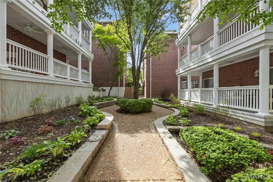 Sophisticated, end unit with gorgeous balcony views!   Luxury condo has dramatic space for entertaining and daily living. Full length windows, gas FP, tree top views, vaulted ceiling in Great Room w/dramatic overlook. Wood floors, fine finishes. built in buffet/server in the Dining Room. Stainless appliances/maple cabinets, center island w/seating in sleek kitchen. The breakfast room opens to an expansive veranda. There is a spacious, master bdrm suite with oversized walk-in closets and luxury bath w/separate shower/whirlpool tub. The second BR/office suite w/veranda access, striking full bath. Laundry on the main floor. An open stairwell takes you to a spacious studio/loft with 3 skylights, huge wine cooler and more storage space!  3rd private BR suite, with a huge bath/walk in shower on 2nd level; great ACCESSIBILITY. All televisions stay with the Unit as well as the large print in the stairwell if a buyer would like them. Elevator bldg, spacious lobby, 2 garage spaces. WALK to downtown Clayton and University City offices, shops, and restaurants.