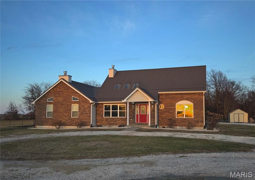 LOOK!!! PRICE ADJUSTMENT!!! Sellers super motivated to sell! 
One and one half story ranch on 3.38 acres along Hwy 61 just south of Bowling Green. The perfect blend of space, privacy, and an expansive Midwestern view. Partial fencing for pets or small livestock, a fire pit and room for playground, pool or other recreation. Surrounded by open fields & a wooded backdrop make for a peaceful retreat. From the sweeping front yard, take in sunsets and watch storms roll in across the Missouri plains.

Step inside to discover a lovely living room with skylights in the vaulted ceiling throwing off great natural lighting. You'll be impressed with the spacious great room designed for both everyday comfort and upscale entertaining. Large enough for a giant rec room or even divide it into different functional spaces. Generous proportions and an open flow provide ample space to host gatherings large or small, while the main and upper levels offer flexibility for a variety of lifestyles. Extending the home’s potential even further, a full unfinished basement presents endless possibilities—whether envisioned as additional living space, a private retreat, or exceptional storage.

This property delivers the enjoyment of country living paired with convenience of town amenities close by.