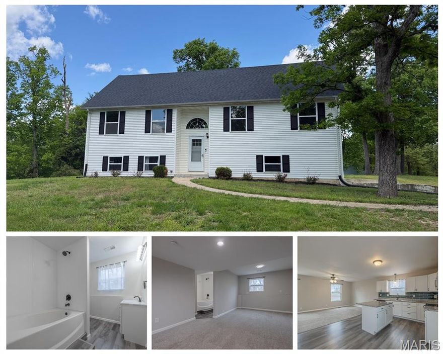 Open House Saturday May 9th 4-5PM! Price Improvement! BEAUTIFUL split level home on almost 1/2 acre with a tuck under oversize 2 car garage!  The main level has a dining area that is open to the kitchen and living area. Kitchen has stainless appliances, glass backsplash and quartz countertops. Large deck off the back with access from the dining area. The 3 bedrooms on the main level are good sized with neutral colors. Primary bedroom has an ensuite with shower. The lower level is mostly finished with a 4th bedroom or could be used as flex space, it has an attached ensuite. Laundry room is here along with access to the oversized garage. On a large lot with some low matainance landscaping. Fantastic location, Wright City school district and public utilities. 15 minutes from Wentzville, Warrenton and Troy. Even closer to Indian camp creek and park. Be sure to set an appointment to see this in person - you will probably love it!