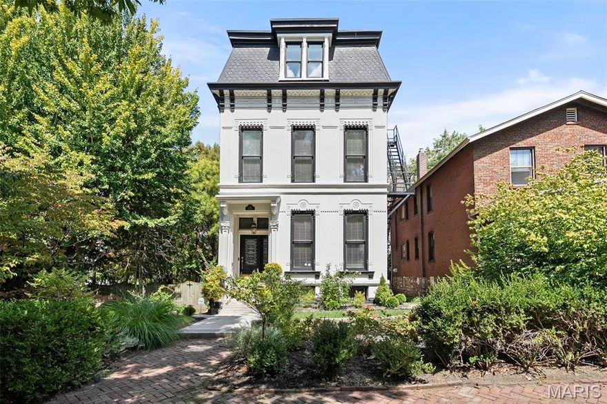 Step into this stunning Lafayette Square gem, offering four levels of finished living space on a double lot just steps from the historic Lafayette Park. Blending original character with refined updates, the main level features 5" white oak hardwood floors and a classic Victorian layout that seamlessly connects the elegant living room, and the show stopping chef’s kitchen, complete with a fireplace, high-end appliances, quartz surfaces, and a stylish butler’s pantry with tile accents. Enjoy your mornings in the cozy family room, also adorned with its own fireplace. As you make your way upstairs, you'll find a private retreat featuring a luxury primary suite with a fireplace and spa-like bath with its own fireplace, three additional bedrooms, a full bath, laundry, and updated HVAC systems for zoned heating and cooling. The third level offers two more bedrooms and a full bath as well. Did I mention the beautiful white oak engineered flooring on both the second and third levels? The finished lower level expands your lifestyle with a spacious rec room, sleeping quarters, a full bath, a second laundry area, and convenient walk-up access to the outside. You'll love entertaining or simply relaxing on the deck overlooking the sprawling double lot, complete with a private 2-car parking space behind an electric gate. This home is a true gem in one of St. Louis’ most coveted neighborhoods, where vibrant dining, shopping, and the serene beauty of Lafayette Park are just outside your door.
