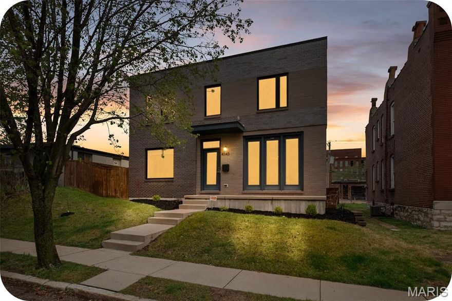 OPEN Sat. 4/4 12-2. If you are looking for a unique contemporary home in the city, look no more! 4143 Blaine is  simply the dreamiest home in Botanical Heights. Travel down the quiet one-way Blaine Avenue to your modern beauty, built in 2018. Enter into a light-filled space with hardwoods which features your dining room and a flexible area that could be used for an office, art studio, play room and more! A half bathroom with cheery wallpaper is tucked away in a inconspicuous corner for privacy. Notice the artistic detailing of the two story custom built architectural wood and metal staircase which sets the tone for the two show stoppers of this floor: the living room and kitchen. The living room is simply drenched in natural light as a former glass garage door was converted in a wall of windows inviting nature in with a sweeping view of your green space. This transitions seamlessly into the kitchen which features Caeasarstone quartz countertops w/an oversized island & waterfall edge, high end appliances, undercounter built-in microwave, 42 inch soft close cabinets and a pantry that meets all your storage needs! Behind the kitchen, check out the mudroom area and a laundry suite. Upstairs, open the double door entry to your primary suite with two LARGE walk-in closets and a spa-like bathroom featuring a deep soaker tub for all your relaxation needs. All closets upstairs are California custom closets. Around the corner, another full bathroom and two good-sized bedrooms round out the floor. The basement is an unexpected treat with two separate living spaces. The first has a bedroom with a true egress window and an abundance of space for a sitting area or office. Pass the full bathroom (making this floor particularly well suited to a guest suite) to your entertainment area which showcases a kitchenette with a retro refrigerator, sink, and a cinema room. And somehow, these spaces are also very bright and do not remotely feel like a basement. Outside, a DOUBLE lot is rare and perfect for kiddos and fur babies. Don't miss the the pergola with berry bushes growing in the corner as you head to your two car garport with an extra storage shed built in. A wall has been built in front of the cars so that your view is unimpeded from your COVERED patio right outside the back door. If the house itself hasn't swept your off your feet yet, the location is chef's kiss: two blocks from City Garden Montessori School, a few blocks to Union Loafers, La Patisserie Choquette, AO & Co, Indo and other restaurants. It's a short walk to the Botanical Gardens and a slightly longer walk to Tower Grove Park. Easy access to both I-44 and I-64 and it's adjacent to the new Tower Grove bike lane (Tower Grove Connector). This home has also already passed occupancy! The cherry on top: a Tax Abatement through the end of 2028 saving you thousands in taxes. :) Hurry to own this very special home just in time to enjoy the spring in your backyard.