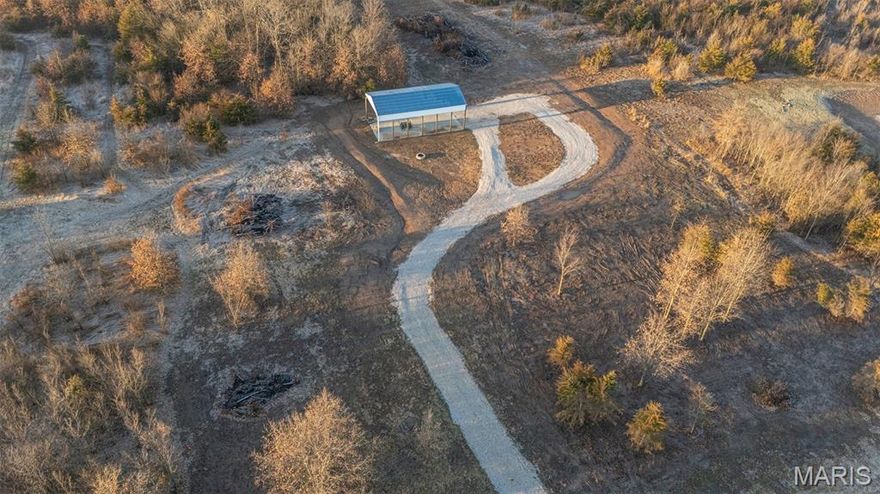 Here is a fantastic opportunity to own a turnkey, move-in-ready property situated on 3.1 surveyed acres with no restrictions in Ralls County, Missouri. Conveniently located just 3 miles north of Perry and only minutes from multiple boat ramps providing easy access to Mark Twain Lake, this property offers the perfect blend of privacy and recreation. The setup is ideal for a weekend getaway or future home site. The property already features water, electric, fiber internet, and a septic system, along with a pavilion large enough to park a camper under — making it ready to enjoy from day one. Whether you’re looking for a relaxing retreat near the lake or a base camp for outdoor adventures, this property checks all the boxes.