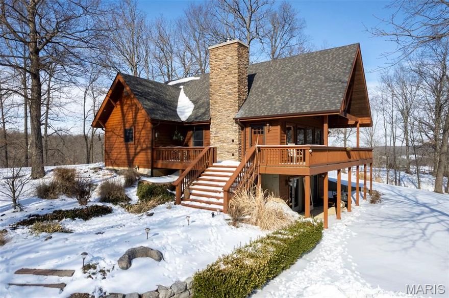 Welcome to this beautiful and truly unique property in a fantastic location, offering privacy, character, and endless opportunity. As you arrive, a private drive leads you to a stunning cedar-wrapped home highlighted by a large porch and expansive windows that bring the outdoors in.  Inside, you’ll immediately appreciate the craftsmanship with rustic wood beams, vaulted pinewood ceilings, and a striking stone wood-burning fireplace anchoring the open floor plan. The main-level provides an open floor plan with kitchen and dining room combo, primary bedroom that features a spacious tile shower, along with the convenience of main-level laundry. Upstairs offers two additional bedrooms and a full bathroom. The fully finished walk-out basement expands your living space with a large family room, fourth bedroom, two bonus rooms, and a full bathroom—perfect for guests, hobbies, or multi-generational living.  Recent upgrades include a new roof, exterior wood siding freshly stained in 2025, and meticulous ongoing maintenance throughout the home. Next to the 2 car garage you'll notice a major bonus for comfort and efficiency is the wood-burning stove that efficiently heats the entire home, providing exceptional warmth during colder months.

In addition to the residence, the property includes a remarkable second building styled as a Treehouse. This 2,500+ sq. ft. space features rustic wood ceilings, barn wood accent walls, large windows, and a stunning 30 x 40 private wood deck surrounded by trees, creating a peaceful and inviting setting. The building includes a commercial-style kitchen, dish room, full bar, two bathrooms, and ample storage. With its layout and setting, it offers incredible potential for revenue generating opportunities for special events such as weddings, parties, restaurant, bar, or even a potential Airbnb.

The property also includes an existing shop and footings already poured for a 40 x 50 shop near the main road, adding even more flexibility and value.

This is a rare opportunity to own a one-of-a-kind property that blends rustic luxury, functionality, and income-producing potential—all in one exceptional setting.