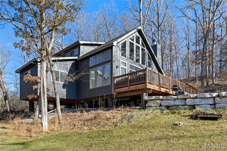 Tucked away on 2.51 acres directly along the shores of Lake Lucern at Innsbrook Resort, this newer-build lakefront chalet (approximately 4 years old) offers a rare combination of privacy, modern construction, and exceptional waterfront living. With over 400 feet of shoreline, the setting is truly special—peaceful, scenic, and surrounded by mature trees and nature in every direction. Designed for relaxed lake living, the home features an open-concept main level filled with natural light and beautiful lake views. A main-level bedroom, 2 full bathhs, and an open sleeping loft plus 2 additional bedrooms provide flexible accommodations for guests while maintaining a cozy, chalet-style feel. Vaulted ceilings and expansive windows connect the interior seamlessly to the outdoors. Step outside to enjoy both a lakeside deck and patio, perfectly positioned for morning coffee, afternoon lounging, or evenings taking in the calm water and sounds of nature. With pontoon boating popular on Lake Lucern, along with kayaking, fishing, and paddleboarding, this property offers true lakefront enjoyment right from your own shoreline. The newer construction provides peace of mind while preserving the timeless Innsbrook character buyers love. For those seeking a private vacation retreat in a  low-maintenance lakefront getaway, this chalet delivers location, acreage, and waterfront access that are increasingly hard to find. Furniture may be available with an accepted offer, subject to offer terms. Opportunities like this on Lake Lucern are rare—especially with this much shoreline, privacy, and modern build quality. Note that rentals are not permitted at this location.