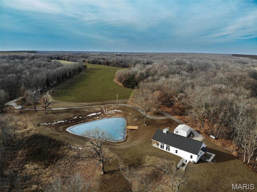 Very secluded home near the Mark Twain Lake located north of Paris, MO. The house is sitting on 47 m/l acres that a adjoins the Corps ground close to the Mark Twain Lake and the property sits up above overlooking Crooked Creek. The Rt. P hunting/fishing access to the Mark Twain Lake is just a few minutes away from the property. The house was built in 2023 and consists of three bedrooms and two bathrooms with a huge open living room, dinning room, a kitchen and a beautiful fireplace. While sitting at your kitchen table you can take in the beautiful view while looking out the large windows and the sliding doors to view the private pond and the open field. You will also enjoy the the porch on the back of the house to drink your early morning coffee in peace and quiet while watching the wildlife. The property has a mixture of row crop and heavy woods making it a great place for the wildlife to thrive. You do not want to let this beautiful property slip by!