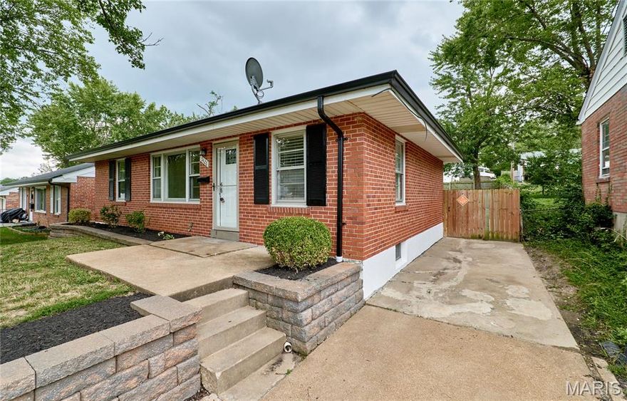 Don't miss your chance to own this beautifully updated and well-maintained brick home! Upon entering the front door and through the cozy living room and dining room combo, the kitchen will immediately grab your attention. New cabinets, appliances and a large island with seating make this well laid out and spacious kitchen stand out among anything in this price point. Of the two bedrooms on the main floor, one has access to the 4-season room, perfect for a home office or sitting room. The full bath on the main floor has also been updated. New flooring and neutral paint throughout. The partially finished basement features a large and open rec room with an electric fireplace, a bonus room and a second full bathroom. The back-yard will check the last of your boxes -- a beautiful brick patio with a built-in firepit and a private, fully fenced yard.