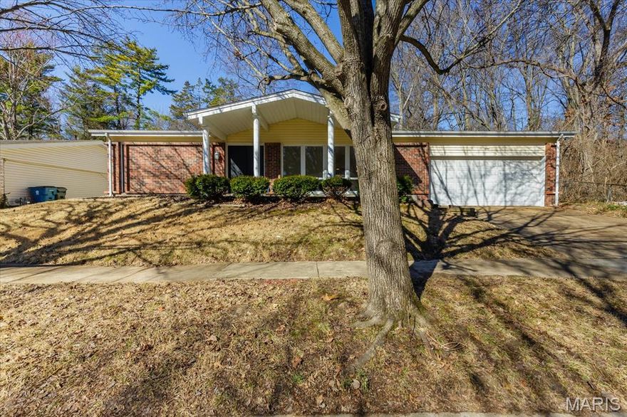 Welcome to this stunning, fully renovated 3-bedroom, 2-bathroom ranch that perfectly blends modern style with functional living. Every inch of this home has been upgraded to provide a move-in-ready experience for its next owner. The amazing kitchen is completely new, featuring sleek white shaker cabinets, elegant quartz countertops, and a full suite of stainless steel appliances, including a brand-new refrigerator. You will love the new luxury vinyl plank (LVP) flooring that flows throughout the entire home. The aesthetic is tied together with new lighting, contemporary black fixtures, and matching black door knobs and hinges. Enjoy a bright, spacious living and dining room combo, plus a separate sitting room featuring a cozy wood-burning fireplace—ideal for relaxing evenings. Both bathrooms are entirely new from top to bottom, reflecting the home’s consistent modern design. This home is built on a slab, offering easy, no-step living without the maintenance of a basement. While there is no lower level, storage is never an issue! The attached 2-car garage includes a rare extra extension, providing ample space for a boat, a substantial workshop, or all your seasonal storage needs. Rest easy under a brand-new roof. Located at the end of a quiet dead-end street, this property backs to woods for maximum privacy. The exterior also features a covered porch and a fenced yard with a patio, perfect for outdoor entertaining.