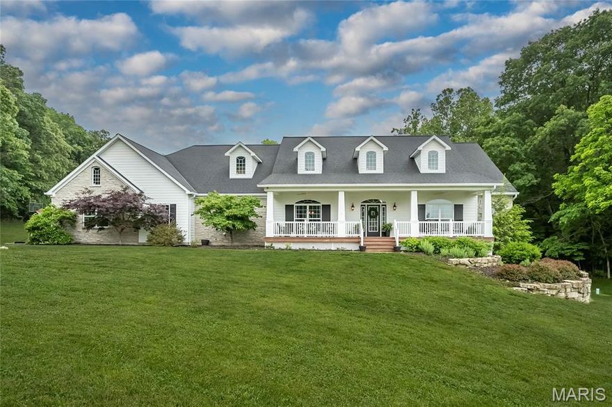 Some people look for years for a custom home on a little acreage where the home is beautiful and the lot is picture perfect...well here it is!! From the expansive COVERED  FRONT PORCH where you can just picture yourself sitting on warm summer evenings, you enter through a gorgeous front door where RECLAIMED WOOD FLOORS lead you from one beautiful room to the next.  An open floor plan where the kitchen island looks toward a STONE FIREPLACE and a covered back porch.  A primary suite with a SOAKING TUB that might be calling your name PLUS a WALK IN RAINHEAD SHOWER. 2 bedrooms share a JACK & JILL BATH, a 4th bedroom is ENSUITE.
BIG MAIN FLOOR LAUNDRY with built in CUBBIES for everyone. This spacious open floor plan invites natural light with a warm inviting feel that starts at the foyer and spreads through every room.  The WALK OUT LOWER LEVEL IS FRAMED TO GRADE with full length windows, atrium doors, and plumbing rough ins for full & half baths, and a bar. This home is on PRIVATE WELL AND SEPTIC, has ZONED electric HVAC. Really easy access to Highway 100 and ROCKWOOD SCHOOLS too. So many things on your checklist are right here, so come on and have a look!
Exterior features include a covered front porch, a spacious covered deck, stone and CEMENT FIBERBOARD SIDING. There's an OVERSIZED 4 CAR SIDE ENTRY GARAGE with room for all your toys! This scenic wooded setting is on approximately 3.5 ACRES of level open yard and mature trees-a simply beautiful neighborhood of custom homes!