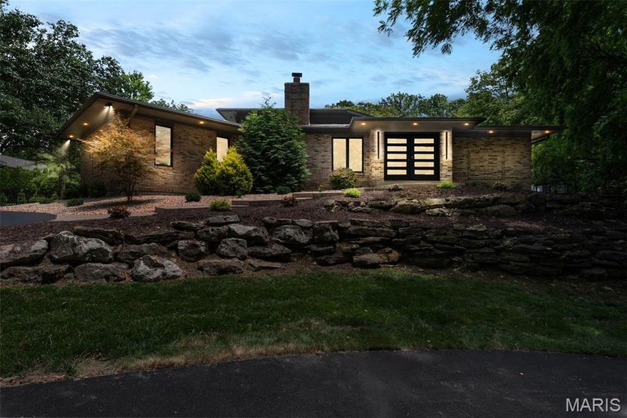 This fully reimagined Sunset Hills masterpiece is a rare blend of modern design, luxury finishes, and one-of-a-kind living. Perched at the end of a private cul-de-sac, the home unfolds behind a striking black steel door into a light-filled interior anchored by a glass-wrapped indoor pool, a year-round showpiece and lifestyle centerpiece. Waterproof white oak floors stretch across a fully redesigned layout with a chef’s kitchen featuring a Wolf stove, custom cabinetry, and seamless indoor-outdoor flow.
The main level includes two bedrooms with ensuite baths and a dedicated pool bathroom, while the expanded primary suite stuns with soaring ceilings, a wall of windows, and wooded views that create a true sanctuary. Upstairs offers two more bedrooms, including one with a charming reading nook and interior window overlooking the pool below. The walk-out lower level is ideal for multigenerational living or an entertainer's dream, with a full kitchen, living area, bedroom, bathroom, and private laundry- Also a room perfect for a golf simulator.
Set on nearly 1.2 acres, this home offers a rare combination of privacy, architectural interest, and lifestyle-driven design. Every inch has been elevated and updated with intention. This is luxury, redefined.