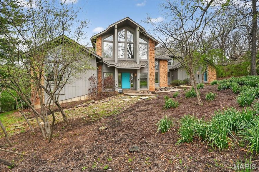 This contemporary Town & Country 1.5-story home offers a rare blend of architectural details and privacy. Set on a secluded 1+ acre cul-de-sac lot backing to mature woods, the property features a private backyard complete with an inground pool, expansive deck, and multiple outdoor living areas—ideal for both entertaining and everyday enjoyment.
Inside, the open floor plan is highlighted by high vaulted ceilings, an open upstairs walkway, and walls of windows that flood the home with natural light. The main level showcases a spacious great room with a fireplace and direct access to the deck overlooking the pool. The large kitchen features a center island, generous pantry, and adjoining breakfast area with access to a sun porch. A formal dining room; open and airy foyer, large utility room, and two conveniently located half baths—one with direct backyard and pool access—round out the first floor. The primary suite is also located on the main level, offering a large bath and an adjacent library that was formerly a bedroom, providing flexibility for today’s lifestyle.
The second floor includes two oversized bedrooms, each with its own large walk-in closet, and a full bath accessible from one of the bedrooms as well as the hallway. A cozy reading nook overlooks the main living space, adding to the home’s unique architectural appeal. The finished walk-out lower level expands the living space further with a family room featuring a stone fireplace, wet bar area, patio access, an additional bedroom, a full bath, and a large office that could easily serve as an additional sleeping area.
Additional highlights include a three-car garage, exceptional storage throughout, and a highly desirable location served by Mason Ridge Elementary School. With its private setting, dramatic interior spaces, and thoughtfully designed layout, this home is a standout offering in contemporary living.

Showings start 4/17
Exterior photos expected Monday 4/20