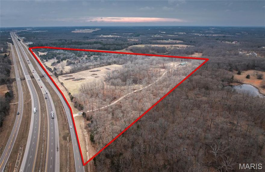 Just 10 minutes from Sullivan, this 64-acre tract along Hwy 44 offers the ideal combination of location, infrastructure, and built-in income. With excellent highway frontage and two established entrances, access is convenient and versatile for a variety of uses. The property features a 32x100 hoop barn, 400 amp electric service already on site, and partial fencing — giving you a strong head start whether you're planning to run livestock, build, or hold as an investment. A year-round wet weather creek winds throughout the property, and the mix of open pasture and natural ground provides flexibility for farming, recreation, or a private homesite. Three income-producing billboards are already in place, creating immediate revenue and long-term investment appeal. Currently zoned Agricultural, this property offers strong future commercial potential given its prime Hwy 44 corridor location — subject to county approval. Hard-to-find acreage this close to Sullivan with utilities, water features, highway visibility, and income-producing assets already in place.