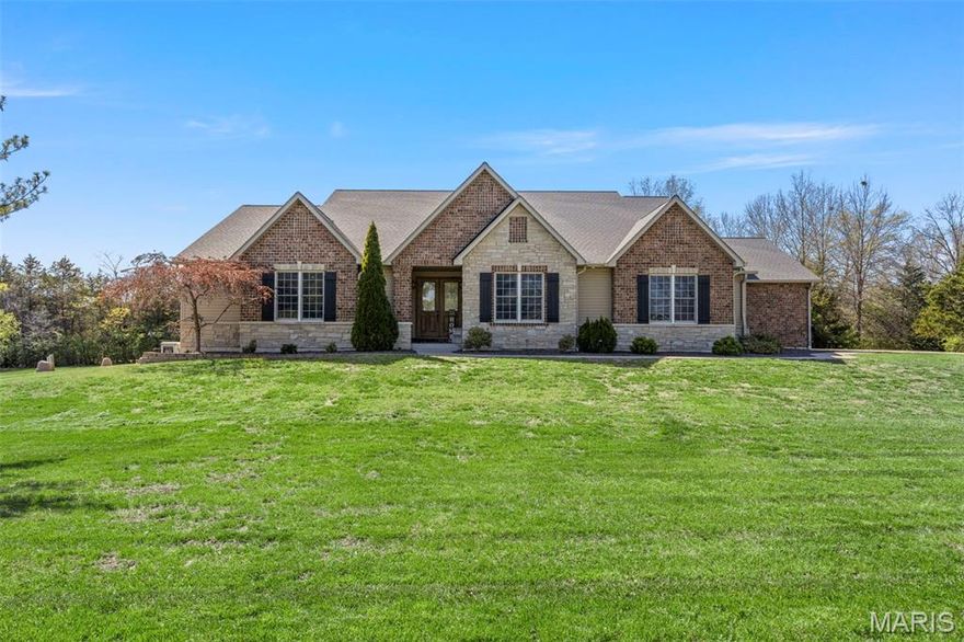 This is the home you’ve been waiting for—a rare blend of luxury, space, and resort-style living that seamlessly blends indoor and outdoor living into one cohesive space.

Featuring 5 bedrooms and 4.5 baths, this home offers soaring 11’ ceilings in the main living areas and primary suite, with 9’ ceilings throughout the rest of the home and finished basement. The custom kitchen showcases granite and quartz countertops, high-end cabinetry, and seamless design that extends throughout multiple spaces in the home.

Your primary suite is a true retreat, a large primary bathroom with dual sinks, heated floor, walk in closet with built in cabinetry, separate tub and shower with walk out access to your beautiful covered patio, including pull down screens.

Custom, high-end cabinetry continues throughout the home including in the office with a built in desk and storage, mudroom with a well planned drop zone and laundry room featuring additional storage as well as a counter perfect for folding.  

3 additional, generous sized, bedrooms all featuring walk in closets round out the main floor.

Enjoy whole-home, zoned surround sound system across the main living areas, basement, patio, pool, and theater downstairs. The finished basement adds exceptional flexibility with a kitchenette/bar, bedroom, full bath, fitness den, rec room, storage, and a built-in safe room.

Step outside to your private retreat featuring a resort-style pool with tanning ledge, KoolDeck surface, electric safety cover, and a heat pump for extended seasonal use, all enhanced by professional lighting.  Don't forget to check out the covered grilling patio with propane hookups for all your grilling appliances, no more lugging propane tanks around.

Additional highlights include a 40x60 outbuilding with a concrete floor and water, a second outbuilding with a concrete floor and water, whole-house generator, LifeSource water filtration system, 1000 gallon owned propane tank with gas grill hookup, central vacuum, heated garage, and more.

With spacious living areas, premium upgrades, and thoughtfully designed indoor and outdoor spaces, this home delivers both comfort and functionality.   Every detail has been accounted for, be sure to request the Special Feature List.