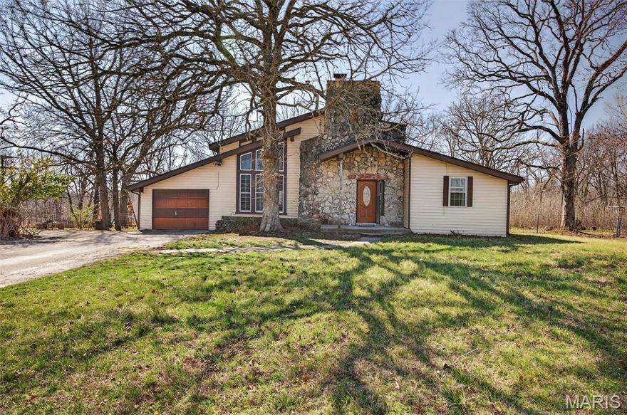 Don’t miss your chance to own this beautiful, one-of-a-kind property on approximately 4 acres. With an ideal layout for starting a homestead or simply enjoying more space, this 1.5-story home offers 4 bedrooms and 2 bathrooms, along with a large living room featuring vaulted ceilings, abundant natural light, and a stunning native Missouri stone fireplace.

Outside, you’ll find a huge fenced backyard perfect for kids and dogs to play. Just east of the home is a barn with 2 large stalls, a chicken coop and run, generous storage space, and covered parking. The mostly level land offers plenty of potential to add fencing, expand your hobby farm, or build the shop you’ve always wanted. A red shop/barn and 13x10 greenhouse also convey with the property.