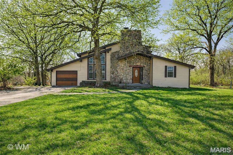 Don’t miss your chance to own this beautiful, one-of-a-kind property on approximately 4 acres. With an ideal layout for starting a homestead or simply enjoying more space, this 1.5-story home offers 4 bedrooms and 2 bathrooms, along with a large living room featuring vaulted ceilings, abundant natural light, and a stunning native Missouri stone fireplace.

Outside, you’ll find a huge fenced backyard perfect for kids and dogs to play. Just east of the home is a barn with 2 large stalls, a chicken coop and run, generous storage space, and covered parking. The mostly level land offers plenty of potential to add fencing, expand your hobby farm, or build the shop you’ve always wanted. A red shop/barn and 13x10 greenhouse also convey with the property.