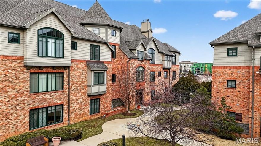 The Terraces continues to stand out as one of the most desirable condominium addresses in Downtown Kirkwood, and with newer high-end developments entering the market, it stands alone as the perfect intersection of top-tier quality and exceptional value in the luxury condo market. With ~2,400 sq. ft., this is the largest unit in the complex, combining its 1st floor convenience with a long list of meaningful upgrades that truly set it apart. The kitchen, renovated in 2021, is the clear focal point. Gorgeous white cabinets and sleek quartz countertops anchor the space, complemented by a Jenn Air gas range, coordinating Jenn Air hood, and Bosch dishwasher. Roll-out shelving was added to the lower cabinets in 2025, elevating both convenience and organization. It’s a kitchen designed not just to look good—but to work beautifully every day. Hardwood floors (2021) extend through the foyer, dining area, great room, hallway, powder room, and second bath. Both baths feature updated quartz counters, sinks, and fixtures, and the primary suite includes a refreshed walk-in closet. Major mechanicals have also been addressed: Bryant HVAC/water heater (2021), as well as all-new Andersen windows (2024) throughout. Two heated underground parking spaces and a private storage closet complete the package—all just steps from shops, restaurants, and everything that makes Downtown Kirkwood such a special place to live.