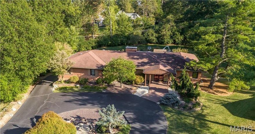 1.14 Acres in Ladue Schools | 4,134 Sq. Ft. Ranch with Pool & In-Laws Quarters
The home features 4 bedrooms, 4 baths, a pool, generous indoor/outdoor entertaining areas, and a walkout lower level with full in-laws quarters.
The main level includes a formal dining room, living room, and a family room with a see-through fireplace and walk-behind wet bar. The eat-in kitchen opens to a partially covered deck overlooking the pool. The primary suite boasts a spa-like ensuite with a separate Jacuzzi tub, multi-head steam and massaging shower, heated floors and washer/dryer. Three additional bedrooms and 2 baths complete the main level.
The walkout lower level offers exceptional living space with a recreation room, second family room with wet bar, and private in-laws quarters featuring a kitchen, laundry, full bath and space for a possible guest suite. You’ll also find three large storage areas and a 4-car tandem garage. Enjoy resort-style outdoor living with a pool, patio, and expansive grounds—perfect for entertaining or relaxing at home.