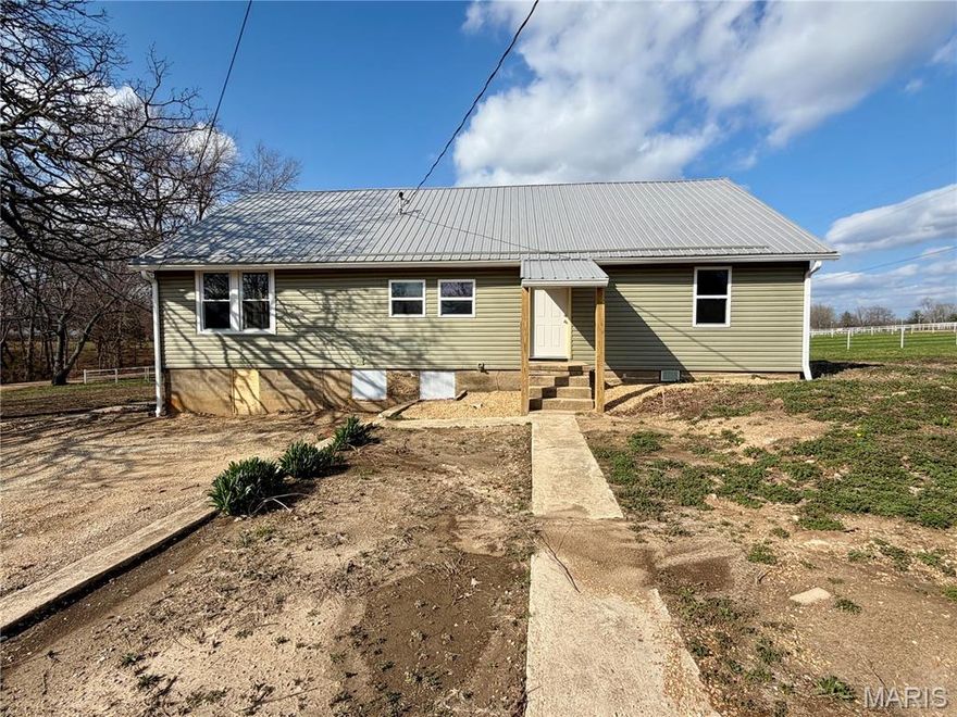 Lovely, updated farmhouse in Salem, Missouri with 1.39 acres.  3 BR, 2 & 1/2 baths, large living room, kitchen/diningroom como with fridge, range, dishwasher, microwave & new wood cabinets.  Additional breakfast room or could be your office.  Wood floors, new carpet in 2 of the bedrooms, vinyl plank flooring in the hall bath,  Primary bedroom suite with wood floors & full bath with tub.  Central air, 4 ceiling fans & an electric furnace.  Lots of tilt-in windows throughout the home add a light, bright feeling!  Freshly painted throughout, partial basement & large attic for plenty of storage.  Detached 3 sided carport, large enough for 2 cars, & it has an  attached workshop/storage room.  Pretty setting with 2 fields for horses bordering the property.  It is located on a dead-end road with only 1 other home next to it.  It has a circle drive way, lovely shaded yard & good garden spot.  Only 1 mile from Salem & 26 miles from the Missouri University of Science & Technology!  Salem is the county seat of Dent Dent County & is only 25 miles from the famous Current River, known for its trout fishing & canoeing.  So much to offer for only $215,000!