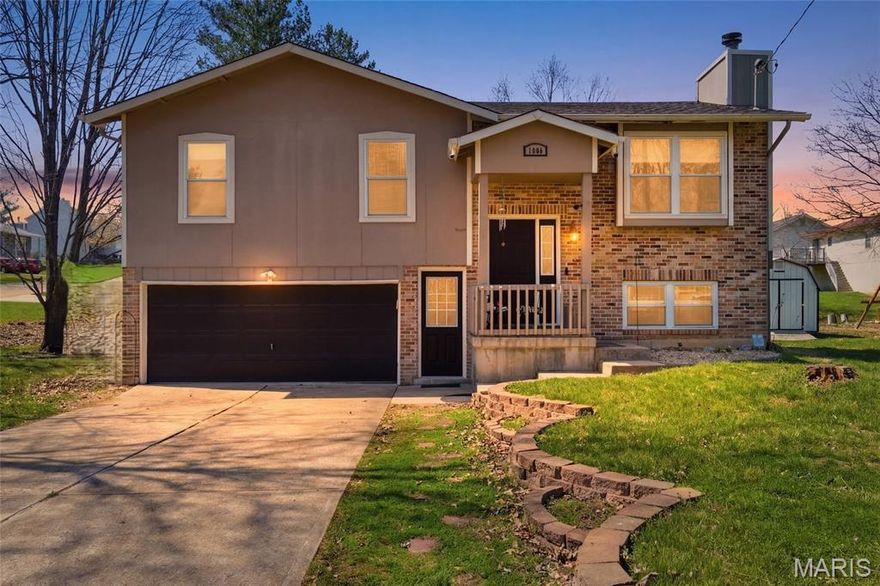 Charming and thoughtfully updated, this 3 bedroom, 2.5 bath home sits on a large corner lot and features a 2-car attached garage and extended driveway for plenty of parking. Multiple living areas provide comfortable everyday living and great spaces for entertaining. A covered front porch welcomes you into the main level where the living room, dining area, and kitchen flow together.

The living room features a shiplap accent wall with a newer electric fireplace and built-in bench seating with storage, creating a warm and inviting focal point. The kitchen has been refreshed with refurbished cabinetry and includes a wall pantry, custom center island built by the homeowner, and a built-in bistro/coffee bar that adds both character and functionality.

Luxury vinyl plank flooring runs throughout the main living areas, while all three bedrooms feature hardwood floors. The staircase and custom banister have been beautifully refurbished and include a built-in pet/child gate.

The walk-out lower level provides a spacious family room with a gas/propane fireplace and half bath, offering flexible space that could serve as a second living area, guest space, or potential additional bedroom.

Recent updates include new roof (2023), HVAC system with heat pump, furnace, and AC (2024), and water softener (2025). Additional improvements include fresh interior paint, refurbished kitchen cabinets, updated kitchen and hall bath faucets, newer refrigerator ice maker, freshly garage door, and refreshed exterior doors.

Enjoy relaxing on the deck or patio overlooking the yard, offering great space for outdoor gatherings or simply unwinding at the end of the day. Great location with easy access to highways for commuting and school activities.