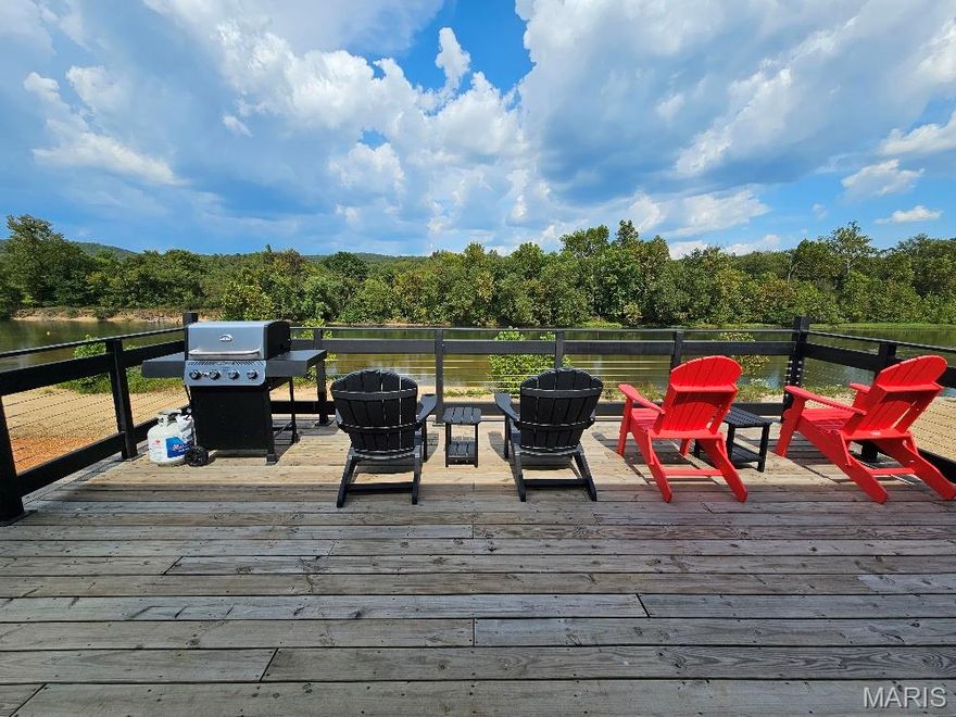 Home is a stunning newly constructed 3 bed, 3 bath, riverfront home sitting off the bank of Current River.  This home comes with 100' of private river frontage with direct access to the water of the Ozark Scenic Riverways.  Sit on the magnificent back deck and enjoy the beautiful views and the beauty of nature and the river.  Inside the home, you will find a large open concept living/dining/kitchen adorned with crown molding, vaulted ceilings, granite countertops, stainless appliances and gorgeous views of the river.  There are 3 bedrooms, 2 of which have French doors for direct access to and from the deck.  The master bedroom is adorned with a spacious bathroom featuring an oversized step-in stone shower with glass doors.  This home comes complete with brand new furniture.  There are 2 drive-through garage doors for easy storage and access to your boats, kayaks, and more.  The lower level features a full bathroom along with plenty of storage area or entertaining area in case of inclement weather.   Whether you want to enjoy relaxing by the water, or on the water, fishing, kayaking, tubing or boating you can hit the river from your property.  Located just south of the bridge and north of Big Springs with many scenic areas to visit such as Peck Ranch, Cave Spring, Rocky Falls and local shopping and dining.  Whether you are looking for a full time residence, investment property, or a short term rental, this home will not disappoint.  Grab your phone and give me a call - the river is enjoyable year round and you don't want to miss out on this beauty.