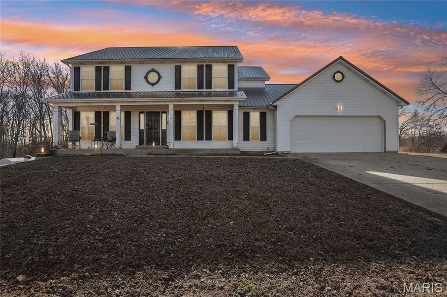 Stop scrolling – this is the one!  Seated atop thirty pristine acres, this estate offers a rare vantage point with breathtaking panoramic views and the quiet reflection of a private pond.  This beautiful home welcomes you with a  two-story foyer and open staircase. For those working from home the main floor study offers built-in oak cabinetry and a private retreat. The heart of the home is an open floor plan featuring a sun-drenched kitchen and breakfast area that flow effortlessly into the living room—while the formal dining room stands ready for your more formal occasions. The second floor is host to 3 secondary bedrooms with large closets, headlined by a primary suite featuring dual walk-in closets and a spa-inspired bath complete with a corner soaking tub and a walk-in shower. Beyond the main residence, the property transforms into a versatile oasis. The expansive 48x40 insulated outbuilding is a masterpiece of utility, featuring a heated shop, loft storage, and dedicated RV housing and covered concrete apron. Complemented by a machinery shed and a livestock pole barn, the mostly-fenced grounds are as functional as they are beautiful. (Property is in the process of being freshly painted!)