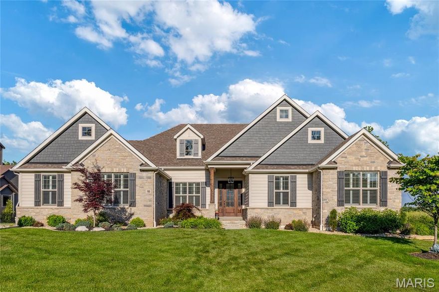 This beautifully designed great room ranch features distinctive architectural elements & upgrades throughout including soaring ceilings, oak hardwoods, contemporary lighting & plantation shutters. Impressive entry foyer leads to private study, formal dining room and stunning great room with 12’ timber beam ceiling, floor-to-ceiling stone fireplace & bank of windows. Designer kitchen with 42” white Shaker cabinetry, quartz countertops, premium appliances, 8’ center island & butler’s pantry adjoins breakfast room with convenient planning center & sliding glass door that opens to screened porch with fireplace. Primary bedroom suite with tray ceiling & luxury bath with freestanding tub plus 2 additional bedrooms & hall full bath complete the main floor living quarters. Walk-out Lower Level includes recreation room with linear fireplace & wet bar, game room, family room, workout room, 4th bedroom & 1.5 baths. Situated on a .7-acre lot with grill deck, covered & open patios & 3-car garage.