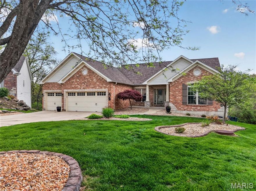 Quiet cul-de-sac living on over half an acre — this inviting ranch backs to wooded common ground for peaceful privacy that connects to Hole 17 Tee box on Lake Forest. Drive your golf cart to the club! Wake up to the morning sun on the screened deck, then gather in the bright, open kitchen featuring a corner sink, a center island, stainless steel appliances with a gas range and hood, abundant cabinetry, and a walk-in pantry. Entertain easily in the spacious great room with a soaring vaulted ceiling, or host dinner in the large formal dining room with a convenient butler’s pantry. The luxurious primary suite is a private retreat with a coffered ceiling, bay window and generous walk-in closet. The owner’s bath includes a whirlpool tub, double vanity, and glass-block walk-in shower. The main level has been freshly painted and newer luxury vinyl plank floors throughout. The lower level expands your living and entertaining options with a massive family room centered on a gas fireplace with built-ins, a recreation room, wet bar, additional bedroom and full bath. There is a three car garage with epoxy floor, plenty of room for your cars and your golf cart! Comfortable, functional and well-appointed, close to Lake Forest Country Club. All this plus Lake St Louis CA lake amenities!