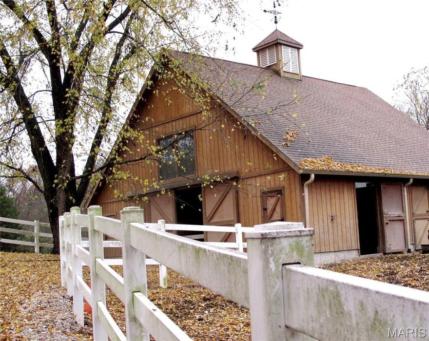 Gem. Charming Wildwood Homestead, for those who want to ride, hike, bike the horse trails in 1600 acre Greensfelder Park right across the street! Beautiful Custom built, all Wood Barn, six stalls, two oversized now, 23’ clearstory ceiling, potential loft. Prime land, rolling pastures with 1.5 miles horse fencing. Second antique barn. Traditional cottage-style custom home, cozy and well-built, front-to-back living room, large windows, crown molding, elegant fireplace, ash hardwood floors. Large back porch overlooking the barn, Total privacy. 1st floor master, large finished lower level living area w/ 'Vermont Castings' type gas stove. All new roofs, new hvac. 3-2-2 on three levels. A special Equestrian Lifestyle in an exclusive location.