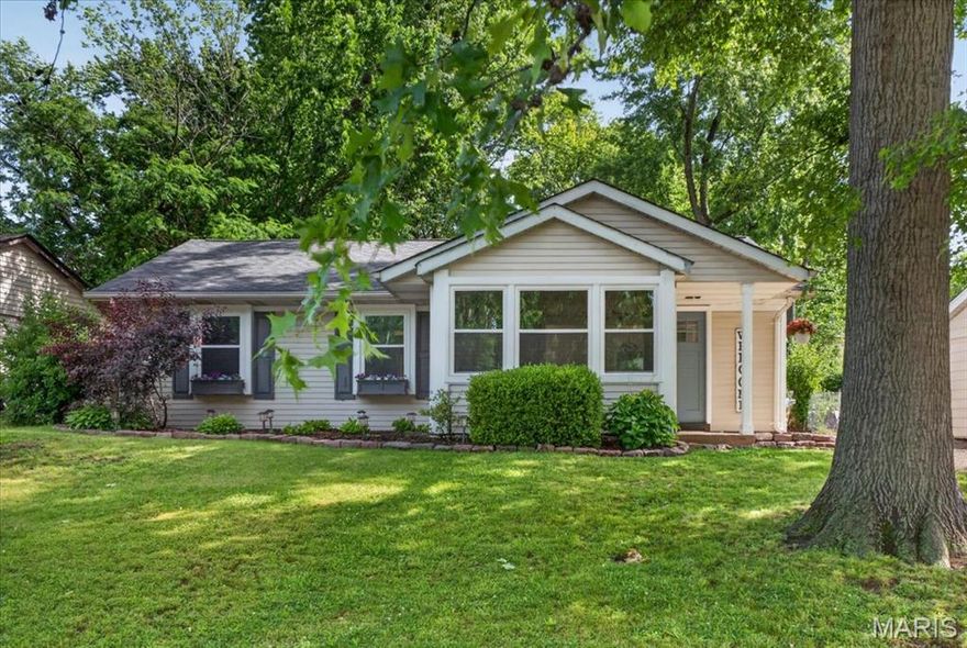 Welcome Home! Nestled on a beautifully landscaped lot shaded by mature trees, this charming
ranch-style residence perfectly blends comfort & character. From the moment you
arrive, the inviting covered front porch and picture-perfect bay window offer exceptional curb appeal. Step
inside to find an inviting living room flowing seamlessly into a eat-in kitchen
the true heart of the home. Kitchen includes custom
white cabinetry, a striking center island topped with warm butcher block, a classic farmhouse sink, gas
range, microwave, and dishwasher. Elegant, low-maintenance vinyl flooring flows flawlessly throughout the
entire main living space and all three bedrooms, making day-to-day cleaning a breeze. The primary
bedroom serves as a private retreat, complete with dual closets and its own direct access door
leading to the outdoor living area. Out back, enjoy your own private oasis featuring a spacious patio looking
out over a beautiful, fully fenced backyard—ideal for entertaining, children, or pets. This turnkey property is ready for its next story. Schedule your tour today!