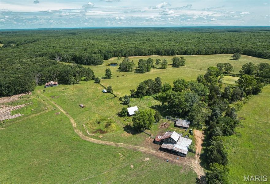 Don't miss this rare opportunity to own a sprawling 354-acre farm that offers the perfect blend of functionality, natural beauty, and endless potential. This incredible property is ideal for farming, ranching, hunting, or simply enjoying wide-open spaces and the great outdoors. Included on the property is a 1-bedroom, 1-bath farmhouse full of rustic charm. While the home is in need of some work, it provides a solid foundation to create your dream country residence, hunting lodge, or weekend retreat. The land itself is a mixture of mostly open pasture and scattered wooded areas, with gently rolling hills, rich soil, and scenic views in every direction. Multiple barns and outbuildings are already in place, offering ample space for storing equipment, housing animals, or expanding operations. 20+ ponds on the property adds both practical and recreational value—ideal for livestock watering, fishing, or attracting local wildlife. It’s also a hunter’s paradise with abundant wildlife and natural cover throughout the property, and surrounded by 33,000 acres of Mark Twain National Forest. With this much acreage, the possibilities are truly endless.