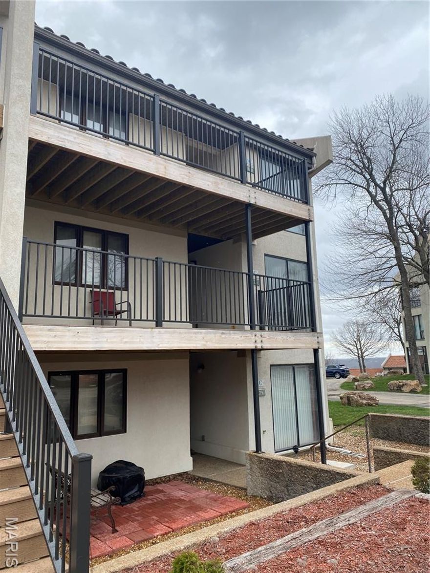 Updated 3rd-floor condo in Osage Vistas at Lake Ozark offering a partial lake view and resort-style living. This 2BR/2BA unit features an eat-in kitchen with stainless steel appliances, living/dining combo with fireplace, wet bar, and washer & dryer included. Enjoy two patios, including a glass-enclosed porch with access from both the living room and primary bedroom, plus composite decking. The primary suite offers a jacuzzi tub, separate shower, double vanity, and walk-in closet. Community amenities include multiple pools, fishing access, boat slip, and a large entertainment pool with activities.  Owner-Agent