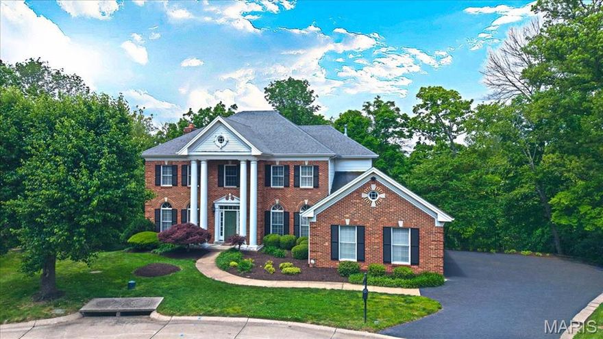 CHARM&MODERN LUXURY meet in this STUNNING 2story Georgian Colonial sits on a quiet cul-de-sac w/a serene, wooded setting.Step inside to find gorgeous oak hardwoods&detailed trim,plantation shutters throughout. The 2-story foyer welcomes you w/elegance leading to a private study, formal dining room&an inviting great room w/a cozy brick fireplace,wet bar,&beautiful built-ins.A chef’s kitchen crafted by Terbrock Design w/granite countertops, 42” cherry cabinetry, commercial-grade appl,8ft center island,flowing into a bright breakfast room w/French doors that open to a large deck.Upstairs, luxe owner’s suite features a coffered ceiling, spa-like marble bath w/freestanding Bain Ultra tub,shower spa,his & hers walk-in closets.3 MORE bedrooms,one with an ensuite and two sharing a Jack & Jill bath.Finished w/o LL has it all,a rec room w/granite bar,game room,fitness area, 5th BR&a full bath.Nearly an acre of private, wooded land w/dual decks&a 3car garage—this home is made for entertaining.