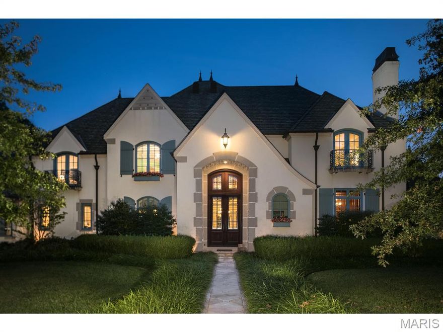 Experience refined living in this extraordinary custom-built estate offering over 10,000 sq ft on a private 1.79-acre lot in the heart of Ladue. Constructed with uncompromising quality, the home features authentic real stucco over concrete and frame construction, ensuring exceptional durability and enduring curb appeal.

Blending classic architectural design with resort-style amenities, this residence showcases rich hardwood floors, soaring ceilings, and exquisite millwork throughout. The main level hosts a sophisticated primary suite with a spa-inspired bath and private outdoor access. Four fireplaces—including one in the vaulted hearth room with exposed beams—create a warm and inviting ambiance. The gourmet chef’s kitchen seamlessly connects to elegant living and dining areas designed for effortless entertaining.

Enjoy geothermal heating and cooling, delivering superior year-round comfort, remarkable energy efficiency, and whisper-quiet operation—an eco-conscious luxury that reduces costs while enhancing livability.

Step outside to your private resort oasis featuring a large pool, lush landscaping, covered patios, and a full pool house with kitchen and bar—perfect for elegant entertaining or relaxed gatherings. The upper level offers a loft-style family room, spacious office, and additional guest suites.

With six bedrooms, exceptional craftsmanship, and a layout designed for luxurious everyday living, this home represents a rare opportunity to own a generational estate in one of Ladue’s most prestigious locations.