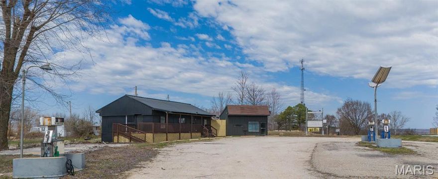 Prime commercial opportunity on high-traffic US Highway 63 South offering outstanding visibility and easy access. This former gas station site presents excellent potential for a variety of business ventures or relocation needs, with fuel tanks already removed for added convenience. The property features two buildings - a main structure of approximately 1,100 sq ft constructed in 1969 and a secondary building of approximately 400 sq ft. constructed in 1987. Situated on a 0.52-acre lot (22,651 sq ft) m/l with approximate dimensions of 211 x 100, the site offers ample space for operations and parking, with a gravel driveway already in place. Both buildings feature durable metal siding and roofing for low-maintenance ownership. Utilities include well water, shared lagoon sewer, and electricity, along with wall unit and mini-split cooling. Positioned in a high-exposure location with state highway frontage, this property combines rural surroundings with strong daily traffic counts—ideal for maximizing business visibility and growth potential! Schedule your private tour of this property today!