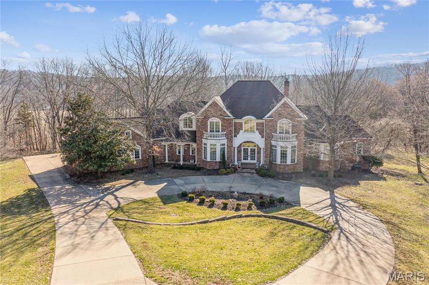 Nestled on a stunning 10-acre wooded lot, this one-of-a-kind custom-built 1.5-story home offers over 7,000 sq ft of breathtaking living space. Featuring 5 bedrooms, 4 full and 2 half baths, this home is designed for elegance & comfort. Step into the dramatic 2-story foyer, leading to a breathtaking Great Room w/soaring ceilings & a wall of windows showcasing serene, wooded views. A beautiful den & formal dining room add sophistication, while the spacious kitchen boasts granite countertops, a center island & a cozy hearth room. The main-floor primary suite is a luxurious retreat, featuring a spa-like bath. Upstairs, find three additional bedrooms & two full baths, while the expansive lower level offers a rec room, media room, 5th bedroom, & full bath. Step outside to enjoy nature from the large deck or sunroom, w/plenty of level yard space, perfect for a future pool! A three-car garage & ample visitor parking complete this spectacular home. Offering privacy, tranquility, & convenience. Additional Rooms: Sun Room