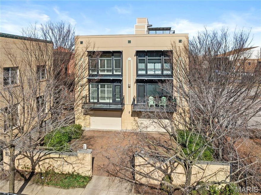 Newer contemporary townhome in the Central West End with a two-car tuck-under, tandem garage.  Fee simple....no montlhy HOA fee. The second level flows effortlessly from the eat-in kitchen with a center island to the dining area and to the living room. The living room features a fireplace and leads to the front balcony. A powder room completes the second floor. Upstairs, the primary suite includes a walk-in closet and a private bath with a dual sink vanity. Two additional bedrooms and a full hall bath round out the upper level. A shared, fully fenced backyard offers space to relax or gather outdoors. Easy walk to Bowood and everything else CWE offers!