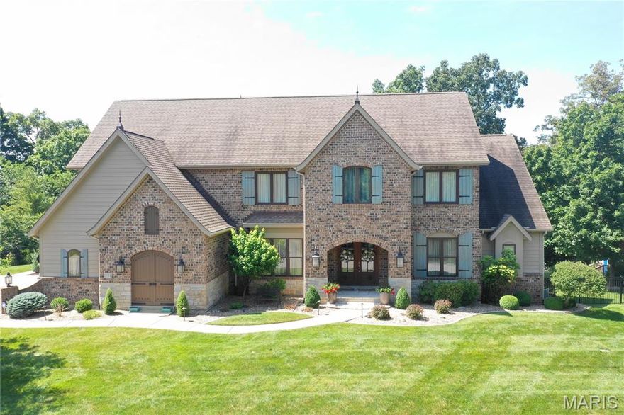 Custom Build Home in Top-Rated School District! 
5 Beds | 5.5 Baths | 6,000+ Sq Ft | Private Pool Oasis

Welcome to this stunning 1.5-story French Country-style home, thoughtfully designed by Flower Builders and packed with high-end upgrades and timeless charm. With over 6,000 square feet of luxurious living space, this 5-bedroom, 5.5-bath home offers comfort, elegance, and plenty of room to entertain.

Main Features:

Gourmet Kitchen (Remodeled 2024) with quartzite countertops, oversized island, 6-burner dual-fuel range with double ovens, and Butler’s pantry — perfect for the culinary enthusiast!

Soaring 2-Story Great Room with wood beam ceilings, stone fireplace, and custom built-ins - remodeled in 2024. 

Three-Season Sunroom opens to a resort-style backyard with an in-ground pool and lush landscaping — your private oasis awaits!

Main Floor Owner’s Suite with spa-like bath, dual vanities, and dual walk-in closets

Additional Main Floor En Suite Bedroom — ideal for guests or in-laws

Upper Level includes 3 Bedrooms (1 En Suite + 2 with Jack & Jill Bath) and a spacious Home Office/Den

Finished Walkout Lower Level:
Host game nights or movie marathons in the Rec Room and Game Room, complete with a wet bar and full bath — an entertainer’s dream!

Exterior & Bonus Features:

Brick & stone exterior with French Country design details

3-car side-entry garage

Main Floor Laundry Room

Custom millwork and architectural touches throughout

Located in a highly sought-after school district

This home is a rare blend of luxury, function, and impeccable design. Don’t miss your chance to own this exceptional property — schedule your private tour today! Contact your agent for showing information.