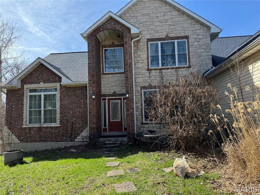 Country living in Labadie/Eastern Franklin County! Charming CUSTOM 1.5 story home nestled on 3+/- level/sloping acres providing peace & tranquility with a chicken coop. Bring your chickens! 2,896+/- SqFt, 4 bedroom, 2 full & 1 half bath home. Hardwood flooring throughout most of home. Covered front porch & 2-story entry greets you as you step inside. Living room features an 18’ ceiling w/balcony from 2nd floor, recessed lighting & a wall of windows allowing plenty of natural light & stunning views of the property. Eat-in kitchen flaunts custom cabinetry, granite counters, center island, stainless steel appliances, walk-in pantry & walk-out to a private deck surrounded by trees. Main level primary suite boasts 2 walk-in closets, recessed lighting and updated bath with double sink vanities w/freestanding sink bowls, custom walk-in shower w/Marble & pebble stone flooring, jet tub and large picture window with the seclusion of trees surrounding. Completing the main level living space is a dining room, laundry room and a half bath. Upper level extends living quarters with a family room that overlooks the Living room, 3 additional bedrooms with slide closets & share hall full bath. Unfinished, walk-out, lower-level has great potential for additional living space just awaiting your finishing touches w/9’+/- ceilings & tub sink. Outside, you will enjoy an AWESOME level, fenced-in front yard & a 3-car, side entry, oversized attached garage. Within the Washington School District, easy access to Highway 100/Manchester Road & minutes to shopping, dining & amenities. MUST SEE!