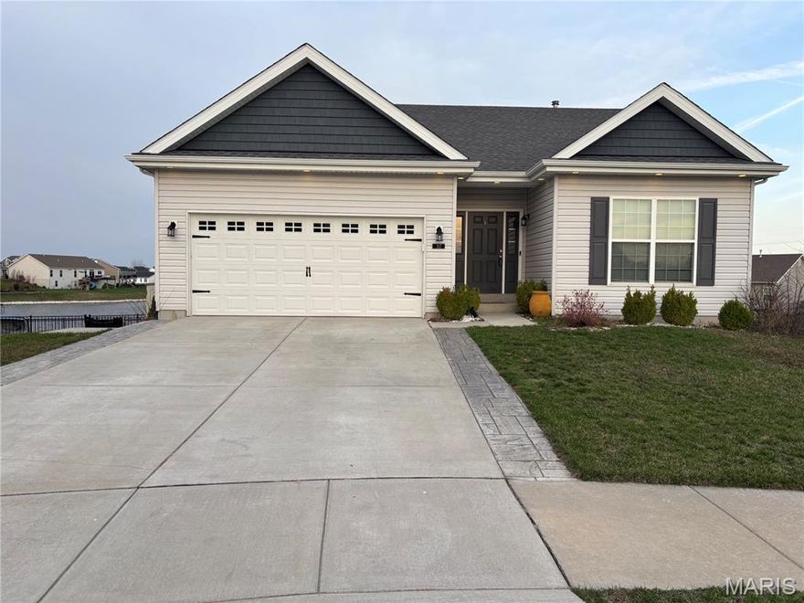 * Move in Ready * Built in 2020* Beautiful backyard views of the Pond from dining room glass slider, large oversized composite deck while grilling/lounging or enjoying the Hot Tub on the basement patio walk out* Direct access to Pond from backyard fence to fish from common ground or by kayak.  * Home is located in Charlestown Place subdivision walking distance to New Town where you can enjoy restaurants, bars, pickleball courts, sand volleyball courts, etc. *
* Home has over 2,000 sq/ft of living space for all the space you need * 4 bedrooms and 3 bathrooms *  Open floor plan for kitchen, dining room and living room with an electric fireplace * Main floor also includes laundry room, large master suite with a sizable bathroom and walk-in closet, 2 additional bedrooms and bathroom* Spacious  2-car garage that includes plenty of over head storage * The walk-out finished basement has a wet bar, open living room/ entertainment room with another electric fireplace, additional bedroom, additional full bathroom, kids bed/tv room under the stairs , plus walk out slider to the hot tub * Community Play ground blocks away and in the Orchard Farm school district*