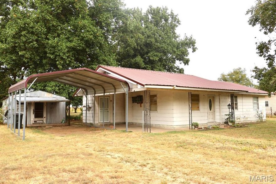 Charming home located right off State Highway M between Clarkton and Holcomb. This cute house offers the feel of country living while still being close to everything. Built on a slab with great bones, it features a convenient carport and a cozy layout, making it the perfect place to call home.