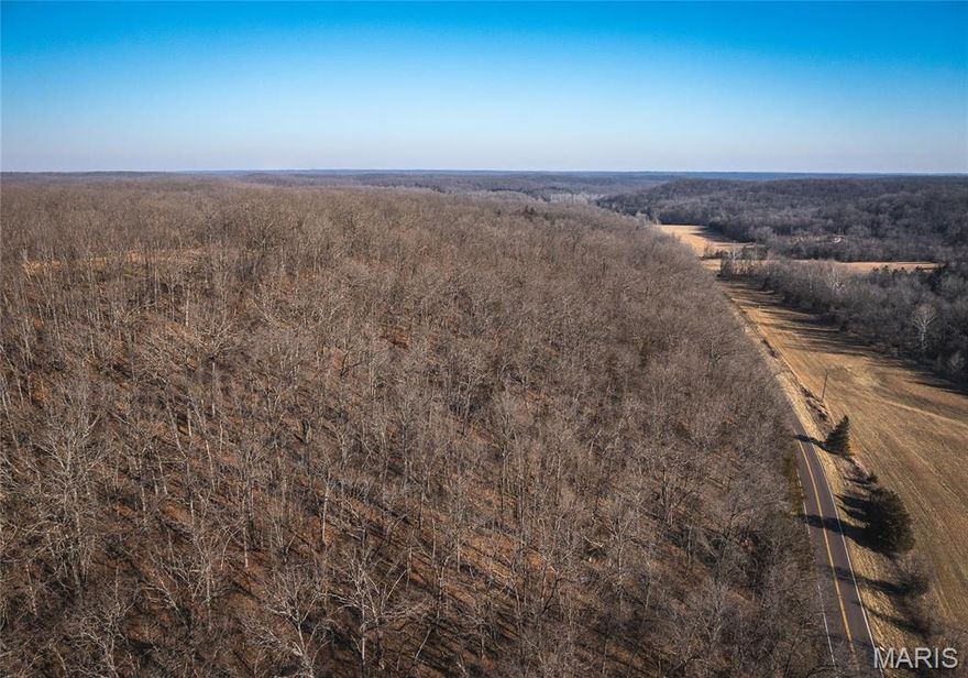 Here is your chance to own 46.53 surveyed acres in the Gravois Mills / Versailles area, near Lake of the Ozarks. Properties like this are hard to find right now— offering the perfect blend of recreation, convenience, and proven hunting success. This diverse tract truly has a little bit of everything. The landscape features South and North facing ridges, valleys, mature timber, thickets, established food plot locations, low ground, wet-weather creeks, and a well-maintained trail system that makes navigating the property easy by foot or ATV. The habitat diversity creates ideal travel corridors and bedding areas for wildlife, making this property extremely productive for both deer and turkey hunting. In fact, this is one of those rare places where you can step out of the truck and realistically have a chance to harvest an animal the very same day. The area is well known for producing trophy-caliber whitetails, and the mix of timber and openings also provides excellent opportunities for spring turkey hunting. Beyond hunting, the property offers great recreational value for mushroom hunting, artifact searching, hiking, or simply enjoying the outdoors. Plus, you’re only minutes from Lake of the Ozarks public launch for fishing or boating at any time. 
Adding to the appeal is a fully finished container cabin designed for comfortable stays during weekend getaways or extended hunting trips. The cabin is supported by generator power, and includes air conditioning, propane heat, and a self-contained water holding system. Inside, you’ll find a thoughtfully laid-out space with a living area, kitchenette, bedroom, and bathroom, providing everything needed for a cozy and functional base-camp. Conveniently located with hardtop road frontage, this property offers easy access while still maintaining the privacy and seclusion that outdoor enthusiasts desire.
Whether you're looking for a turn-key hunting retreat, recreational getaway, or a unique property in the Lake of the Ozarks region, this tract is truly one of a kind.
Schedule your showing today and come see what makes this property so special.