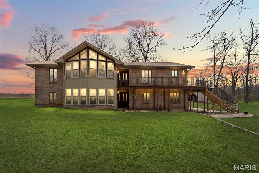 Escape to the perfect blend of privacy, space, and country charm with this stunning 42.25-acre estate just minutes from Farmington.

This spacious 5-bedroom, 3-bath, two-story home offers nearly 3,000 sq. ft. of comfortable living, designed for both everyday living and entertaining. Inside, you’ll find two cozy fireplaces, generous living areas, and plenty of room for family and guests. Step outside to a massive deck, perfect for hosting gatherings, enjoying peaceful sunsets, or simply taking in the beauty of your land.

The property itself is where this one truly shines. A picturesque mix of open pasture and mature woods, complete with a tranquil creek running through, creates the ideal setting for a hobby farm, hunting retreat, or private homestead.

Outbuildings add incredible functionality and value, including a 2,160 sq. ft. metal building with RV carport and hookup, perfect for equipment, storage, or workshop space, and a 1,008 sq. ft. chicken house/shed ready for livestock or flexible use.

Whether you're looking for a peaceful country retreat, space to grow your operation, or a place to build your dream lifestyle, this property delivers it all.