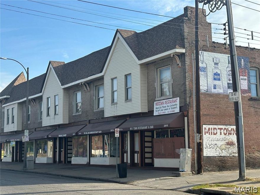 OWN THE BLOCK and make money while doing so! This block long commercial building with six (6) business units and six (6) 2 bedroom, 1 bathroom apartments each 1400 Square Ft. Retail, Barber/Beauty Shops, Home Healthcare, Health & Wellness, Bar & Grill, Lounge, etc. The business opportunities are endless. Apartments rent $750 each & Businesses rent $1250 each for total $12000/monthly all under market value. This building will pay for itself in less than five (5) years. Two large parking lots in the rear and on the side with more than 20+ parking spots. Separated with a city garden maintained and own by the city.