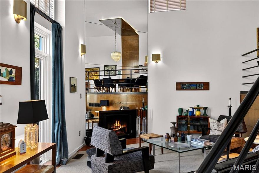 Discover an architectural masterpiece at 6 Benton Place, where historic elegance meets modern sophistication. This stunning three-story brick home on one of the most sought after streets in Lafayette Square is thoughtfully designed and perfect for entertaining. The exterior space is anchored by a low deck, meandering brick walkway, lush landscape and small pond which set an inviting tone, leading you inside to a realm of style and comfort.  Once inside, you're greeted by a suspended staircase, artfully positioned at a 45-degree angle, serving as the centerpiece of this remarkable residence which spans 3 floors and 5 levels. The homes interior exudes a Mid-Century Modern (MCM) vibe, accentuated by mood lighting and an abundance of natural light that flows seamlessly throughout.  You’ll find the right mix or large entertaining spaces and smaller, more intimate spaces for relaxation and quiet contemplation.  Additionally, there are 3 bedrooms, 2.5 bathrooms and bedroom level laundry.  The finishes are highly curated including terra cotta brick paver floors, natural wood panels and flooring, Kalista fixtures, Kohler tile, custom wood cabinetry, Subzero, Viking, Asko, Artemide lighting, etc.  The luxurious wool carpeting adds a touch of comfort, while the open floor plan allows for versatile living and entertaining spaces. This residence, embodies a perfect blend of historic charm and modern amenities, offering an exceptional living experience.  Experience the epitome of refined living in a home that truly stands out in the heart of St. Louis.